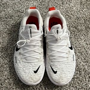 NIKE Free 5.0 in white with leopard detail print. Super cute!! Gently loved.